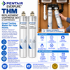 Pentair Everpure THM replacement cartridge set in an under-counter bathroom sink setup, showing two silver and white filter cartridges installed in a cabinet, alongside product information, specifications, and certification logos.